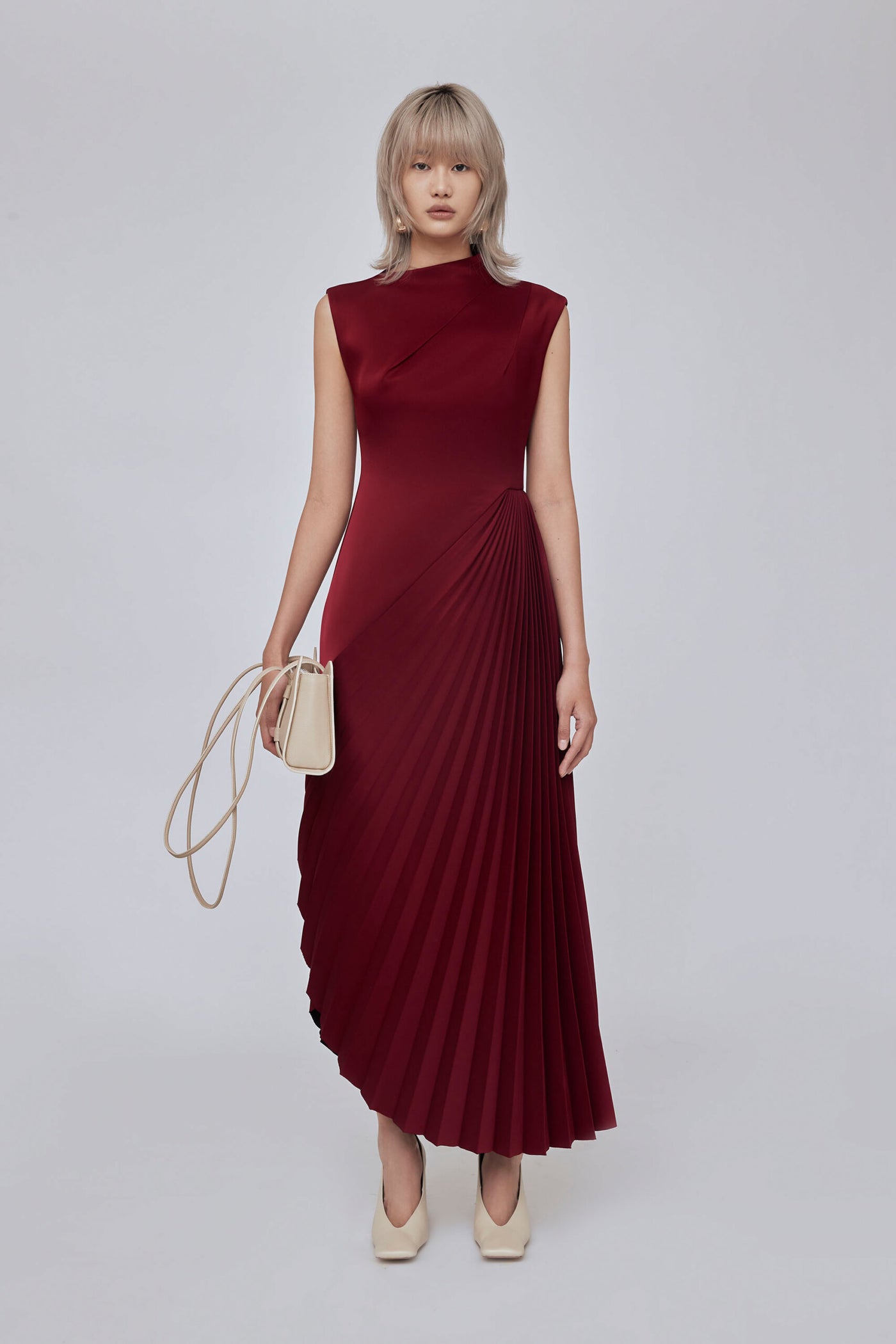 Mid-length A-line dress with asymmetrick neckline and pleated detail