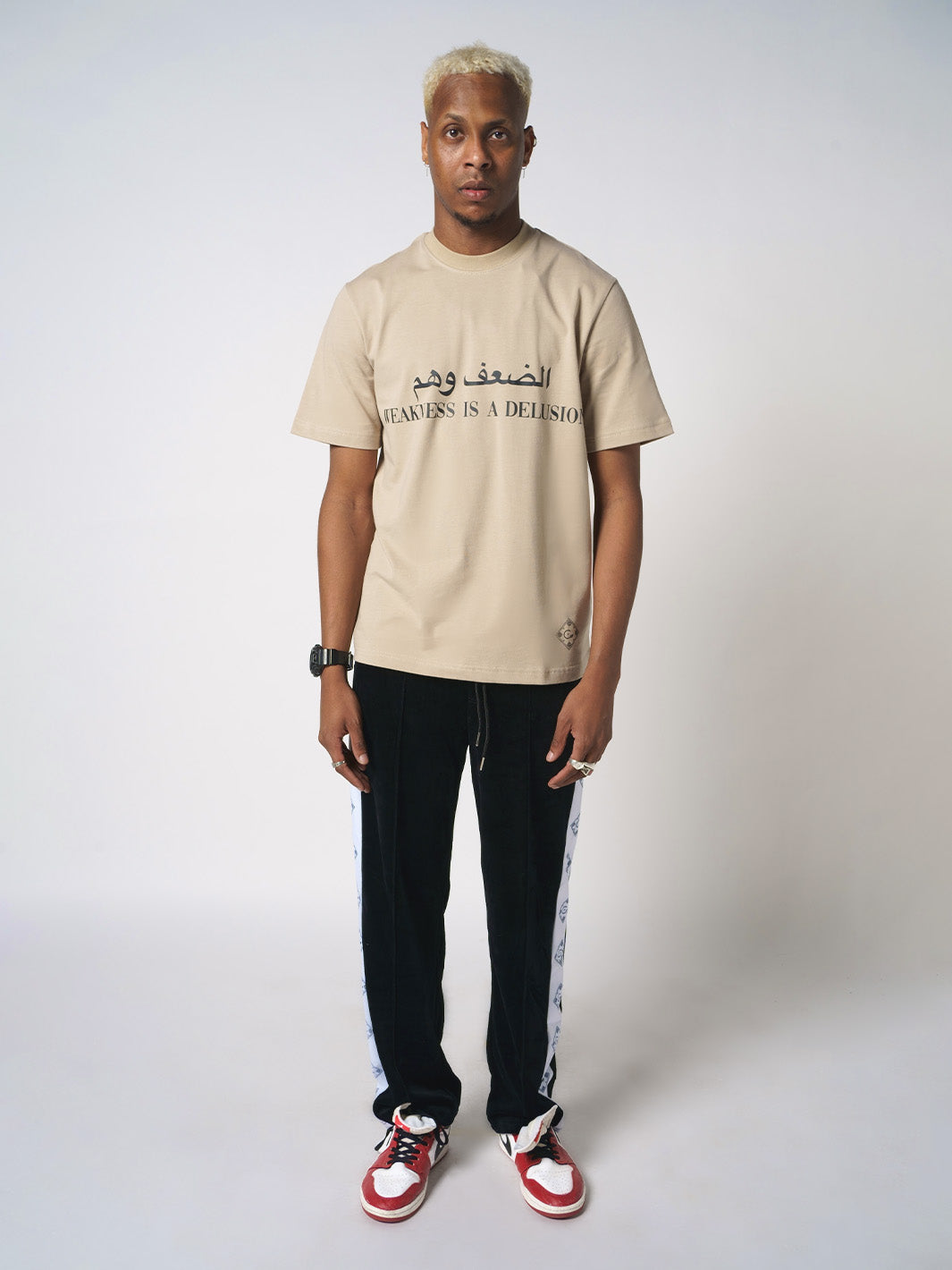 BEIGE  WEAKNESS IS DELUSION T-SHIRT