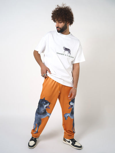 ORANGE PANTS WITH WOLF PATCH